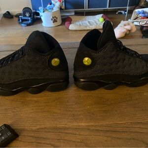 Black Sneakers with Green Accents
jordan 13 black cat 🐈‍⬛